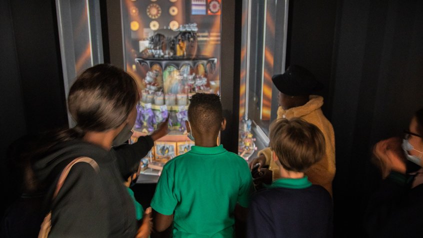 Students gather around the acmi cuphead zoetrope