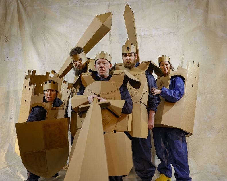 Five people in cardboard knight's costumes