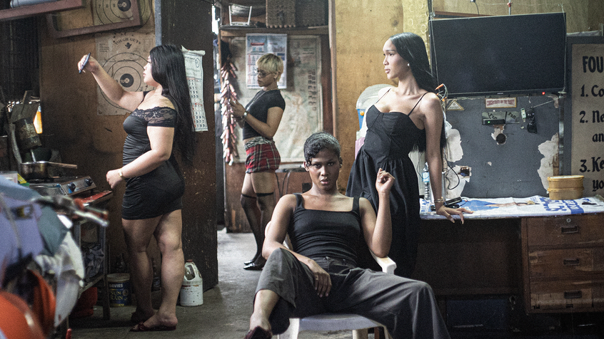 Four women posing in backroom of a business