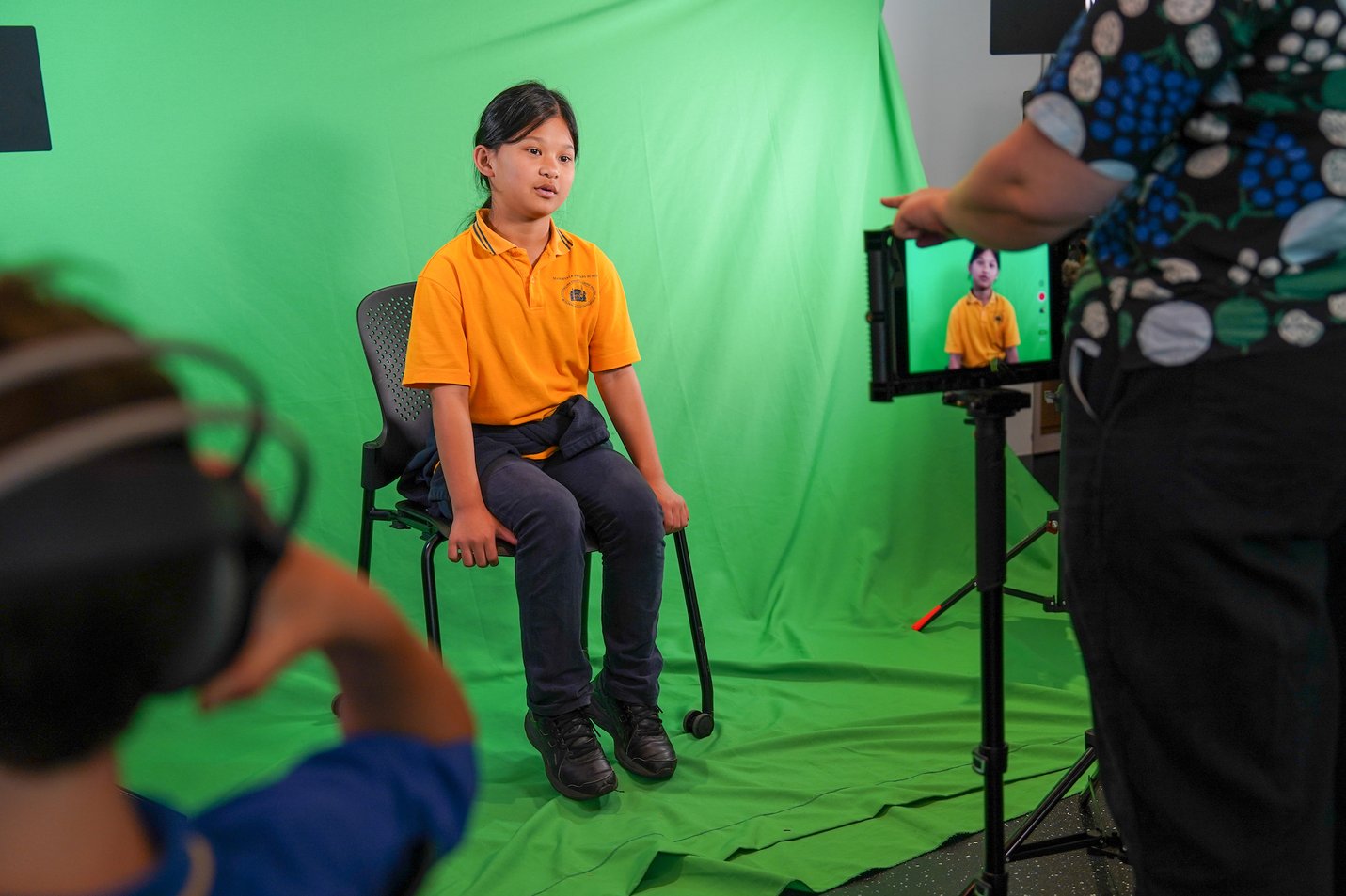 Student performs in front of the green screen Student performs in front of the green screen