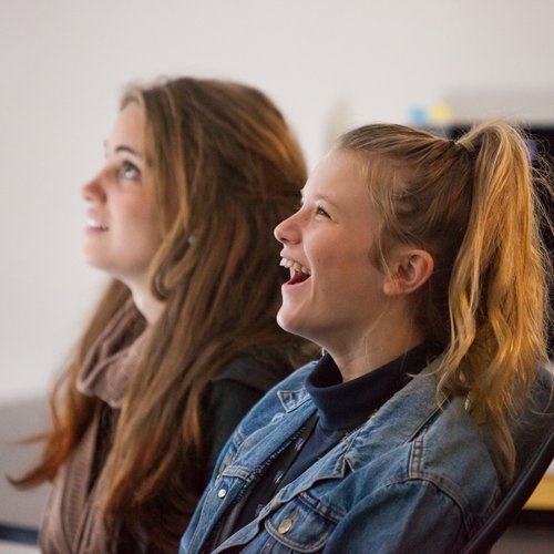 Secondary school students viewing a screen