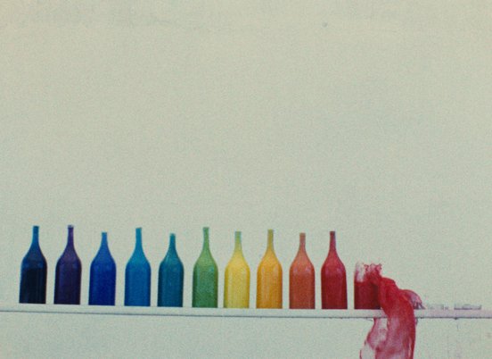 Rainbow arrangement of bottles in a still from 'The Colours' (1976) (c) Kanoon
