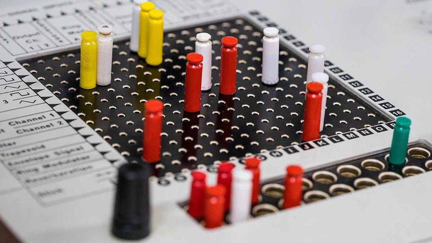 ACMI + MESS Partnership - multi-coloured plugs on a soundboard