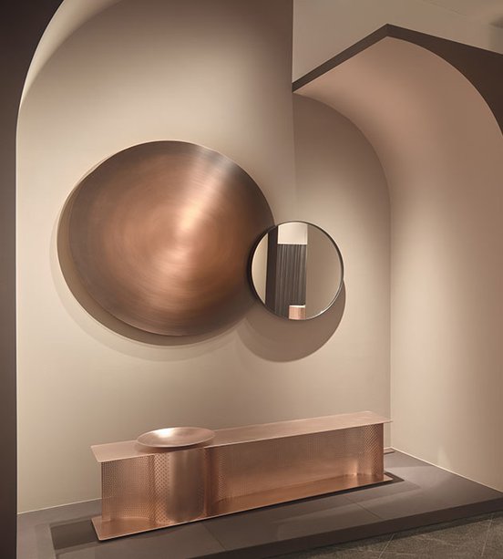 A circular copper-toned art installation - still from 'Object to Project: Giorgetti Design since 1898' (2021)