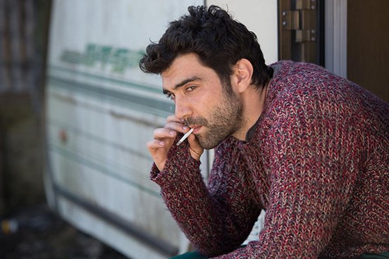 Alec Secăreanu's smoking a cigarette in a still from 'Gods Own Country' (2017)