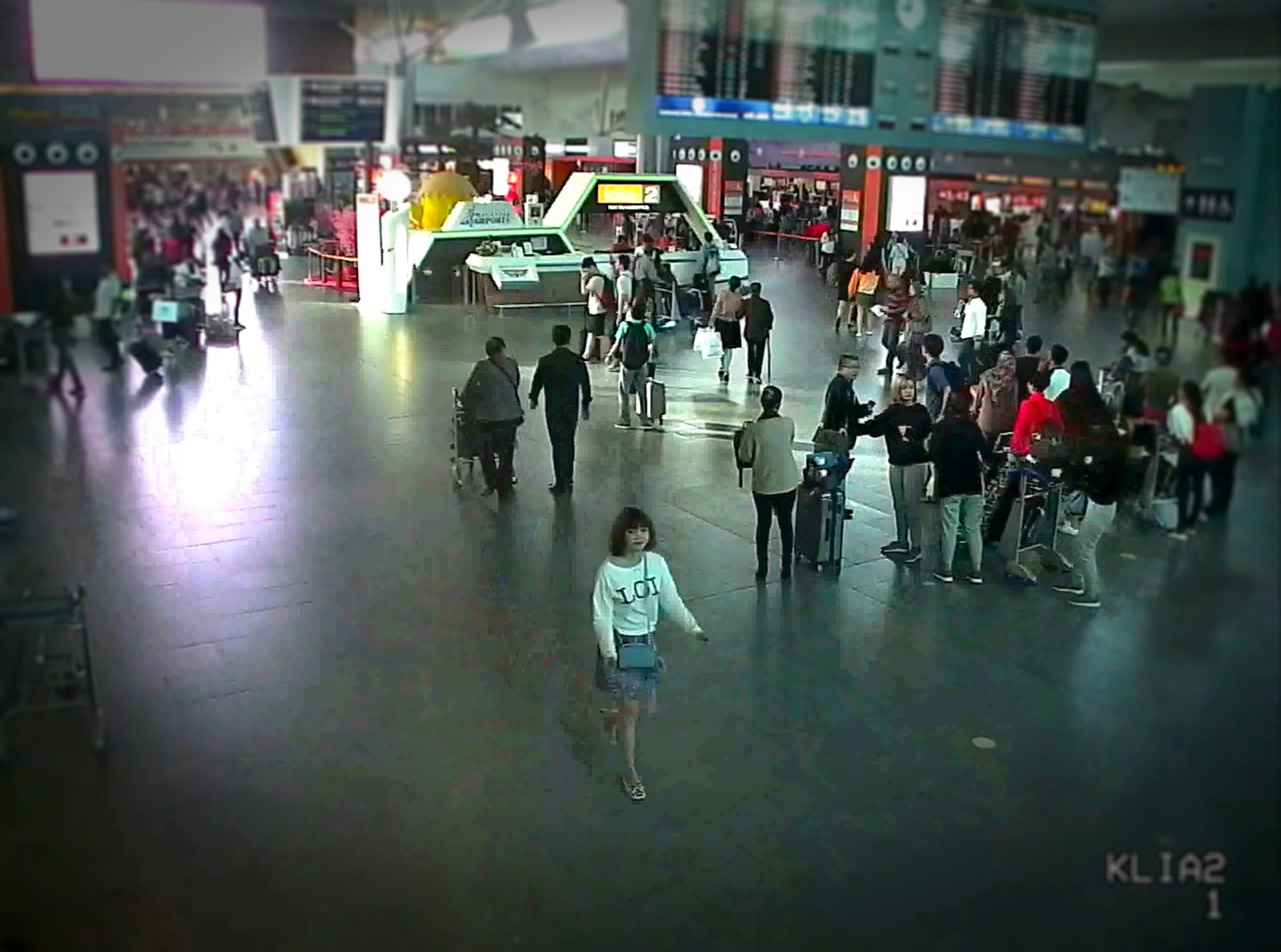 Still from Assassins - footage of Doan Thi Huong exiting KLIA after the assassination