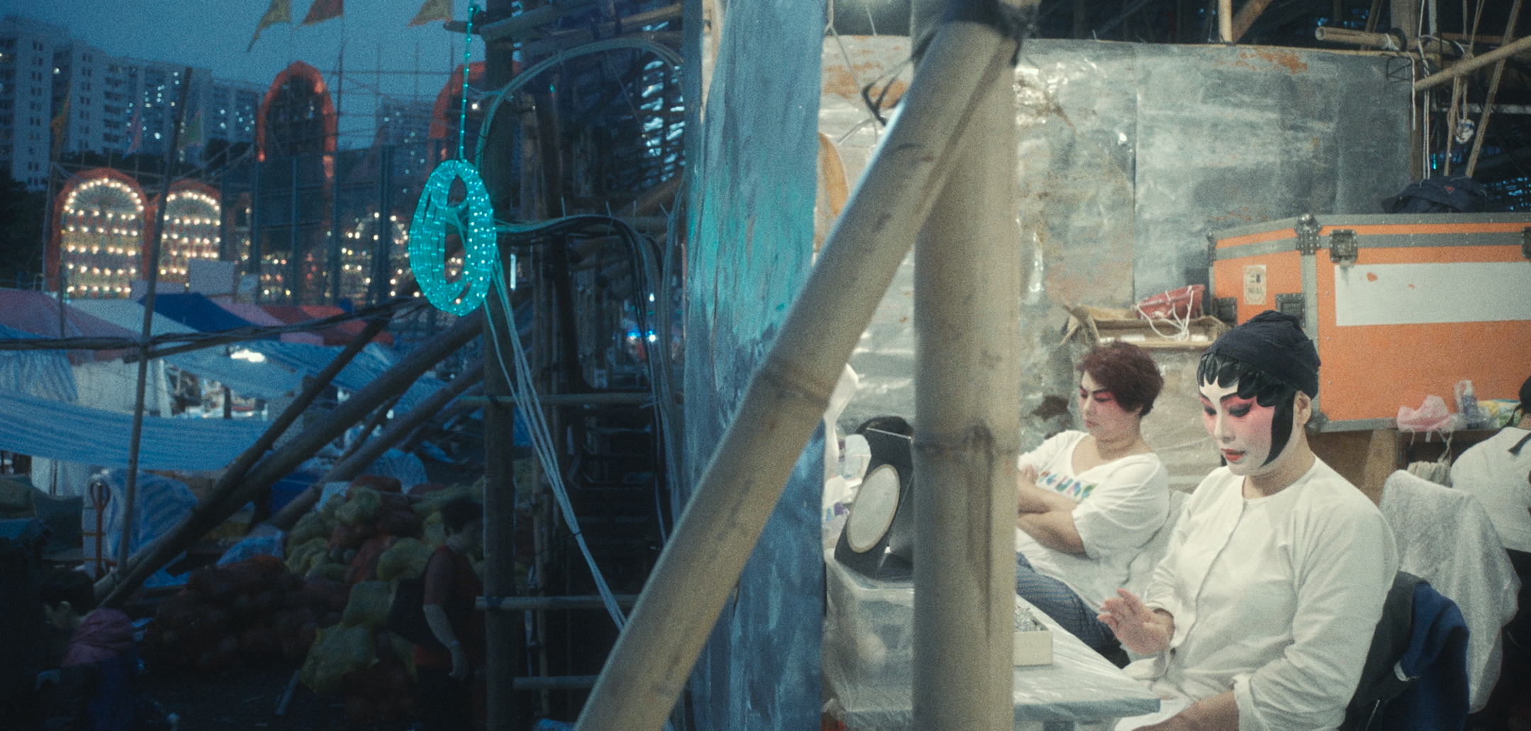 A split view of inside and outside the theatre - still from Bamboo Theatre (2019)