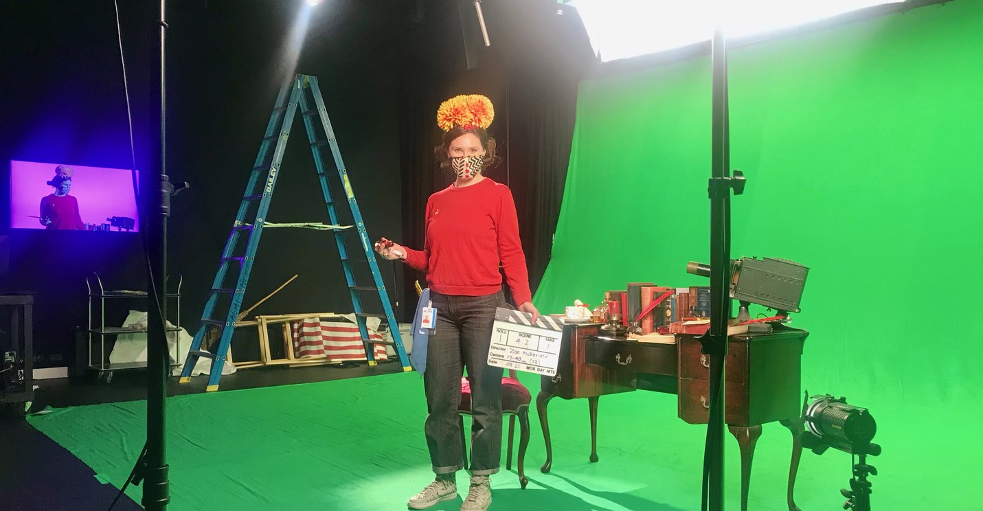 An ACMI Education facilitator on a green screen set in a Fairytales and Fantasy Education workshop