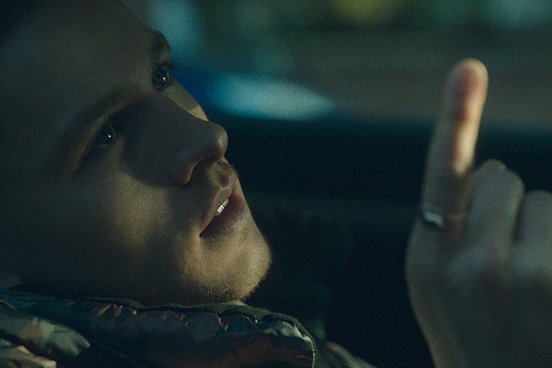 Harris Dickinson pointing with his forefinger in a still from 'County Lines' (2019)