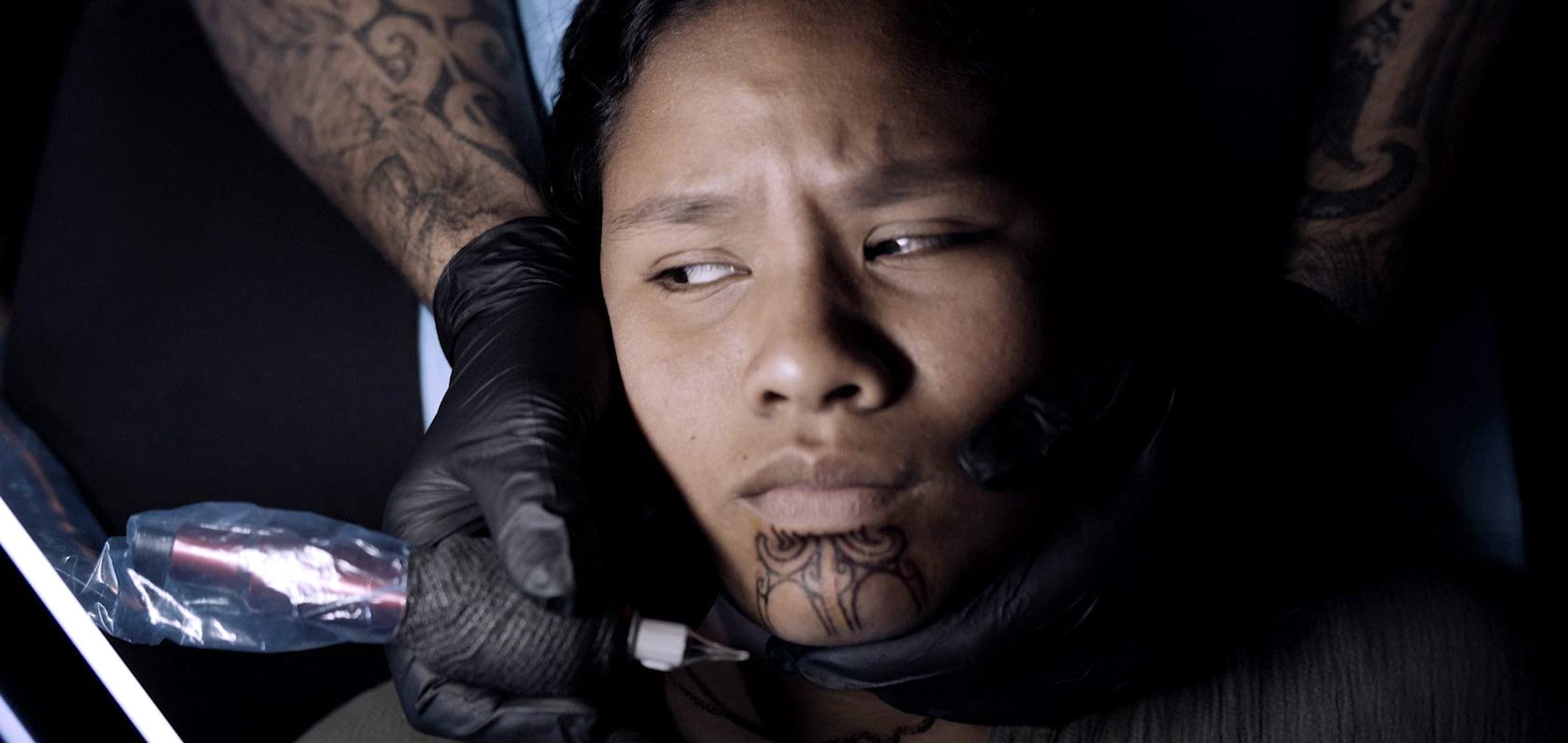 He Mangai He Korero - girl getting tattooed