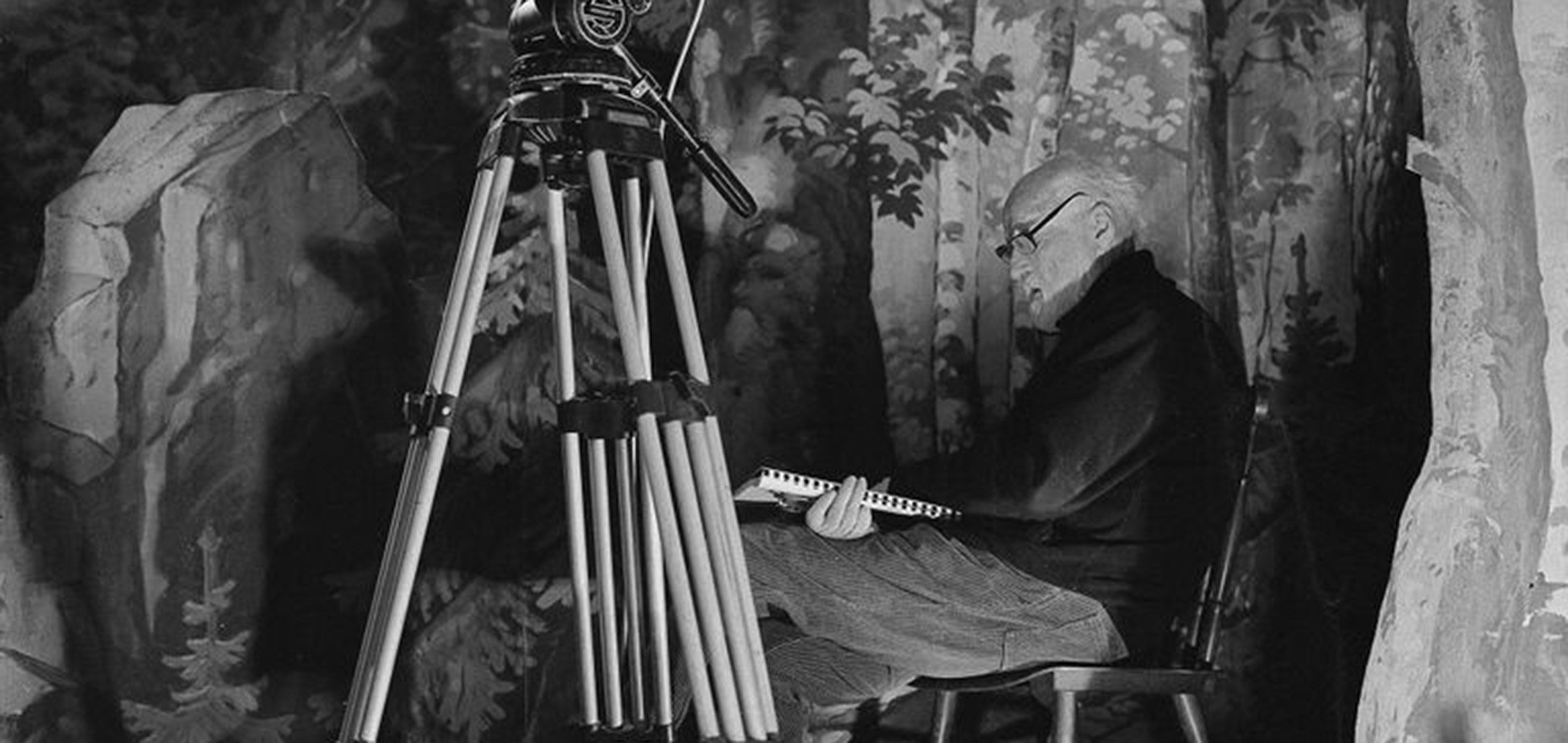 Jan Švankmajer reading a script behind a camera in a still from 'Athanor - The Alchemical Furnace' (2020)