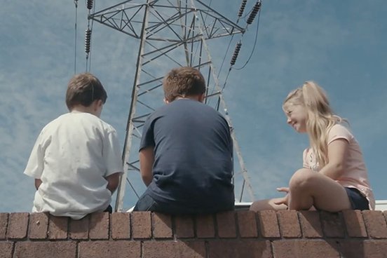 Kids sitting on a wall - still from 'No Ball Games' (2020)
