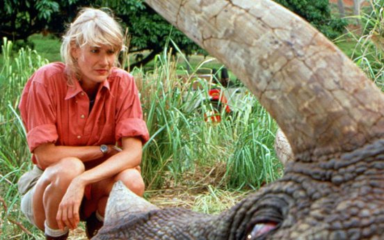 Laura Dern looking at a sick Triceratops in 'Jurassic Park' (1993)