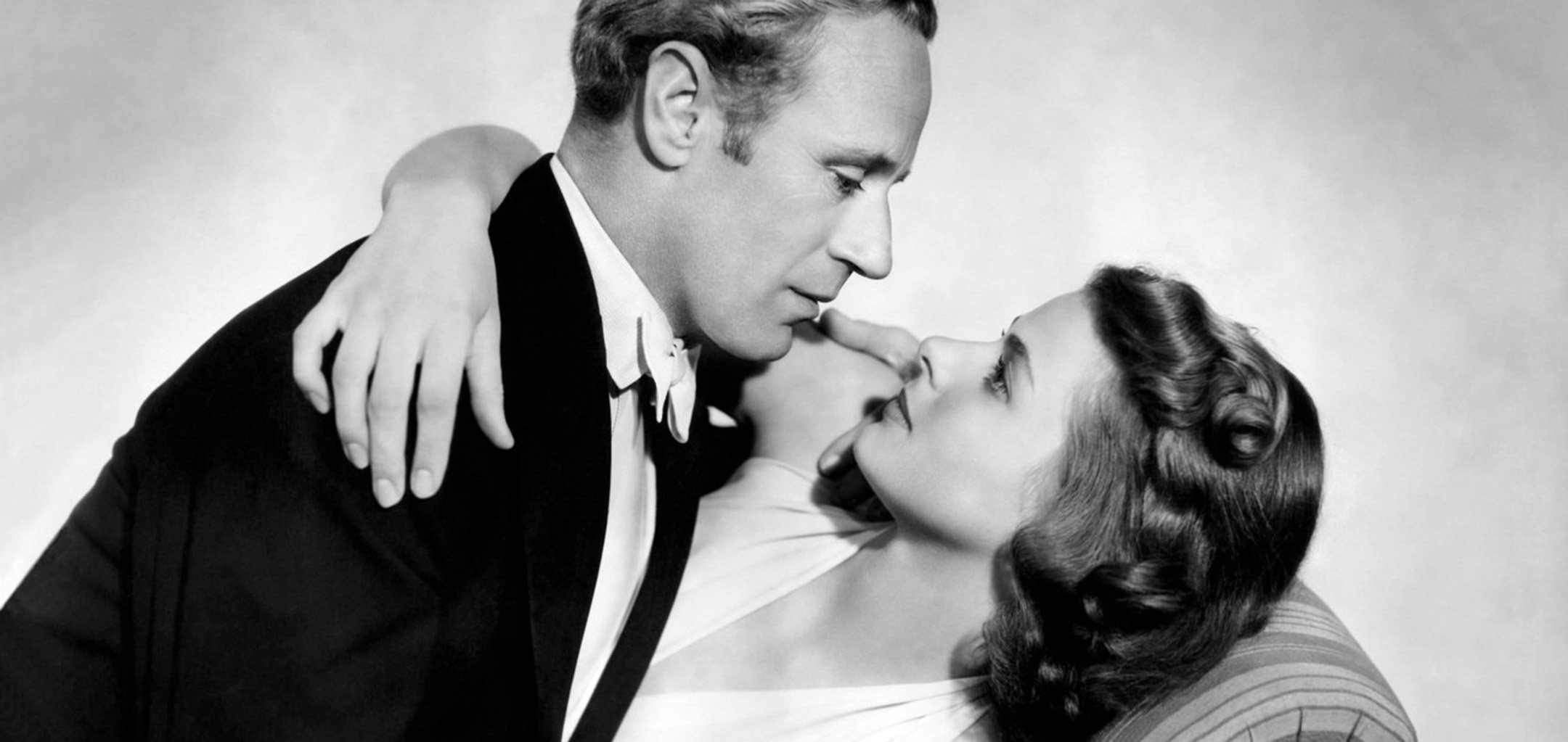 Leslie Howard and Ingmar Bergman in a loving embrace in 'Intermezzo: A Love Story' (1939)