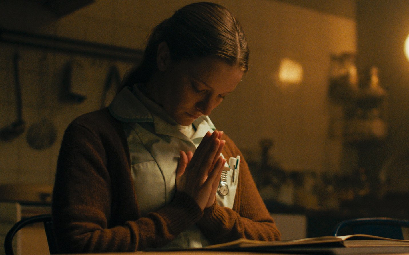 Morfyyd Clark in Saint Maud (2019) praying