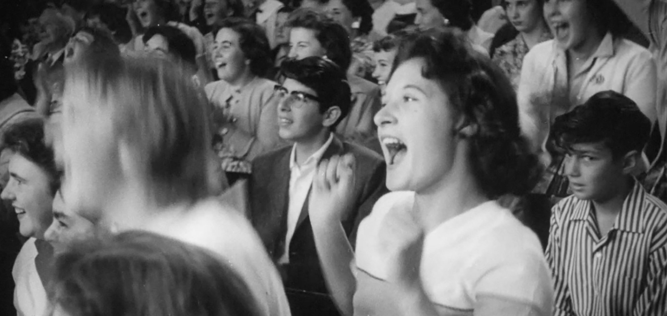 Still of young woman screaming in crowd of concert in 'Rock 'n' Roll' (1959)