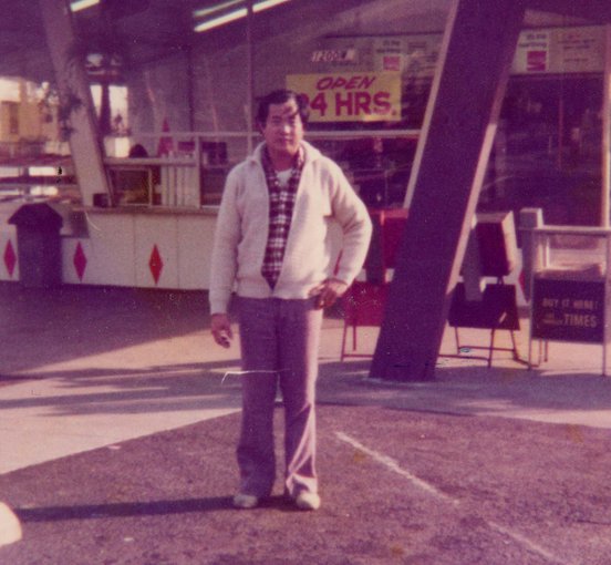 Ted Ngoy stands outside his first donut shop