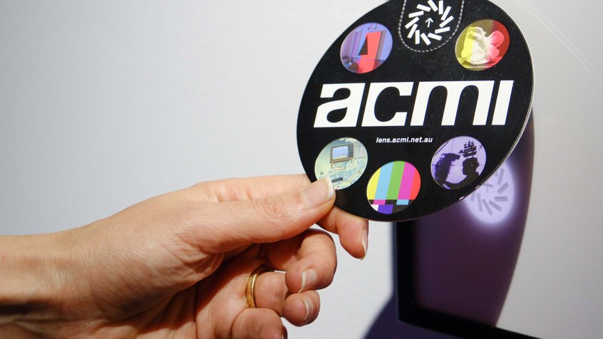 The Lens device being tapped on an exhibition label - photograph by Gareth Sobey