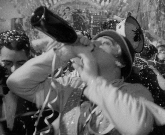 I Vitelloni (1953) - character swigging a bottle of champagne