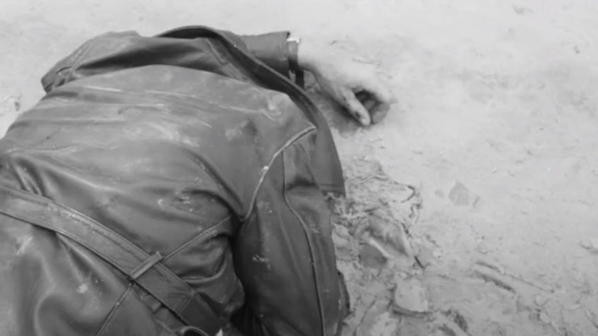 Dead man - still from 'head_phone_film_poems' by Ross Gibson