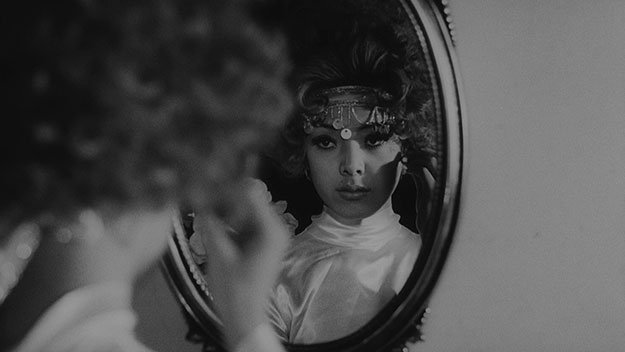 A still from Funeral Parade of Roses - looking in the mirror