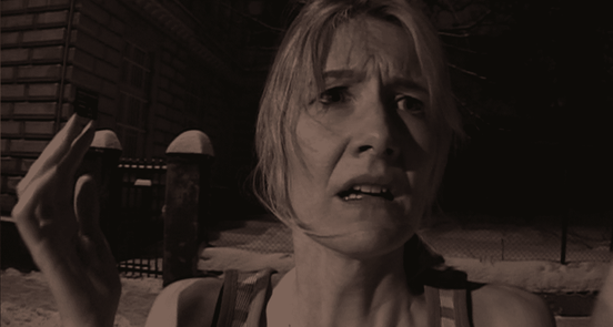 Closeup of Laura Dern looking worried, in sepia tone - still from Inland Empire (2006)